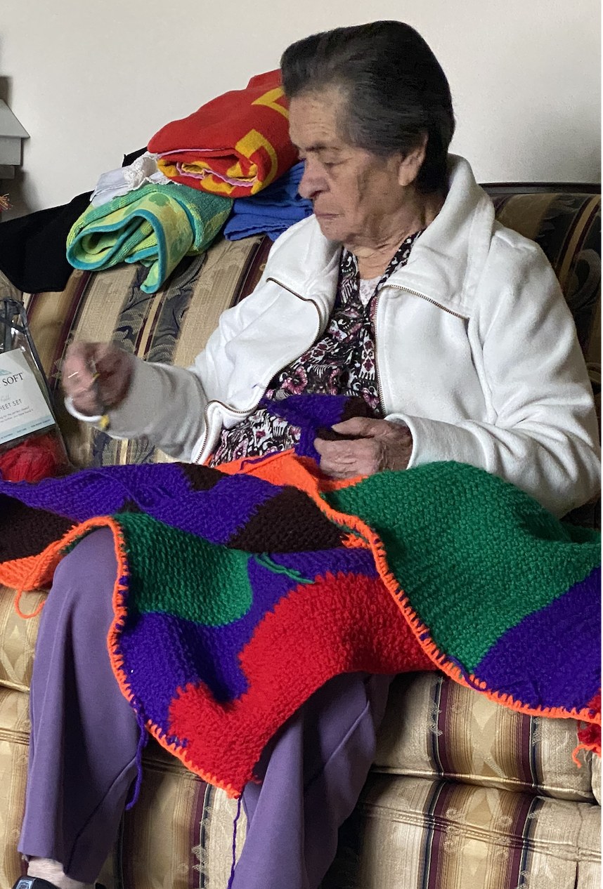 My grandmother crocheting a blanket
