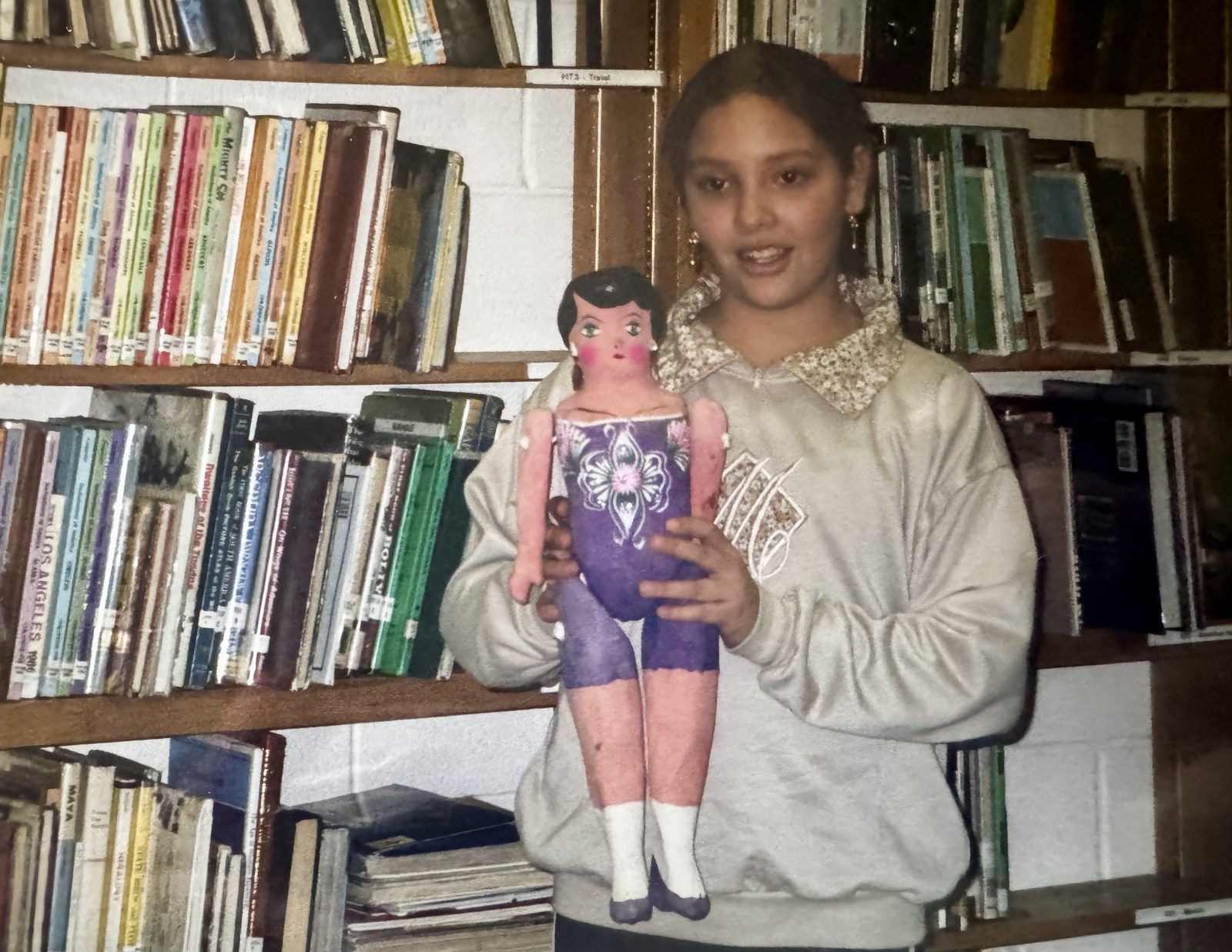 Presenting a handmade doll to the class