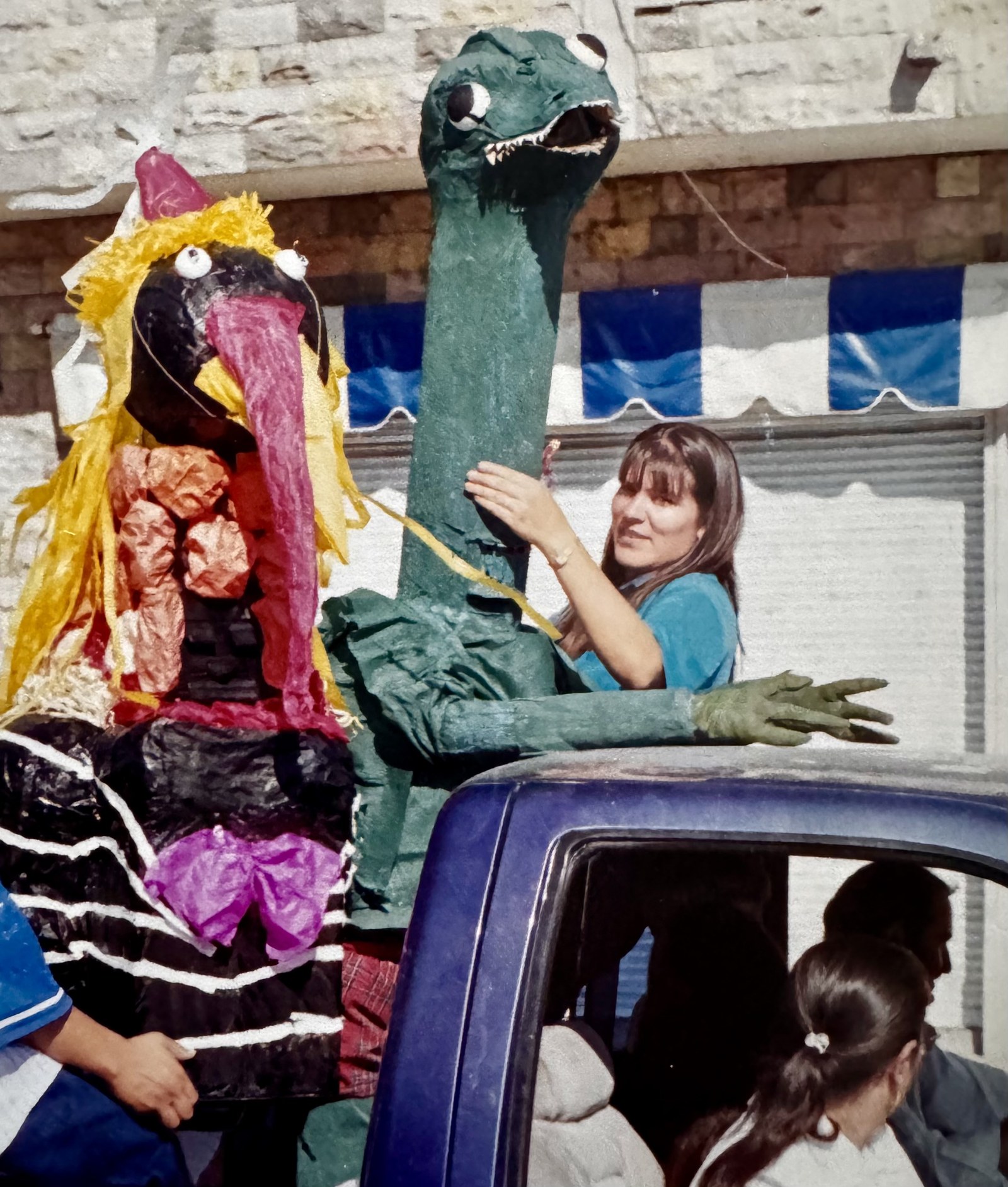 The festival in Mexico. I am the dinosaur, my cousin is the wild turkey